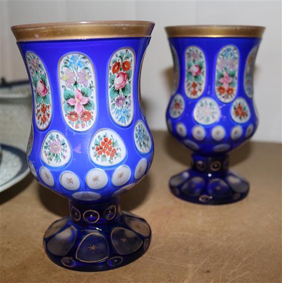 A pair of Bohemian blue and white overlaid glass vases, 16cm